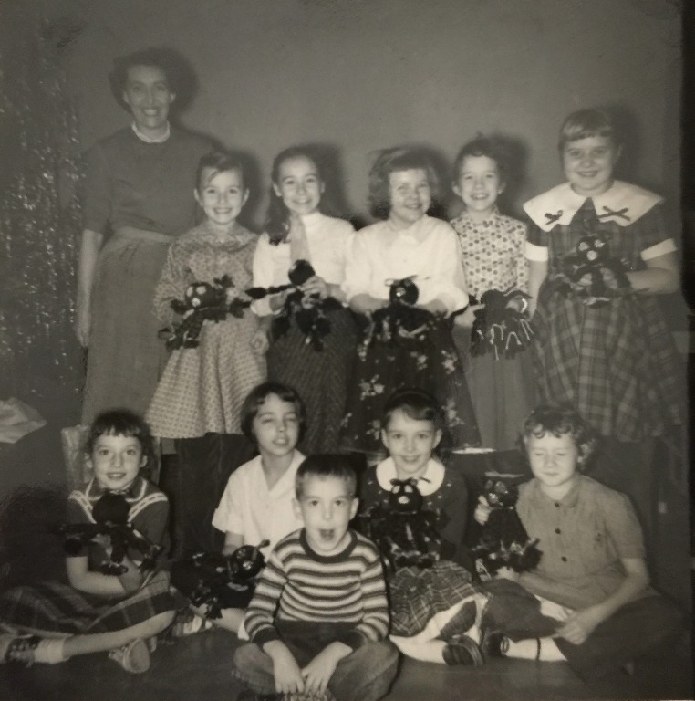 Girl Scouts South Main 1957 Mrs Arnold, Beth Ann Noe, Jan Chamberlain, Harriet Mills, Suzanne, Rectenwald, Susie Wolf, CAnn Sanders, Bette Hang, Nancys brother and Nancy, Barbara